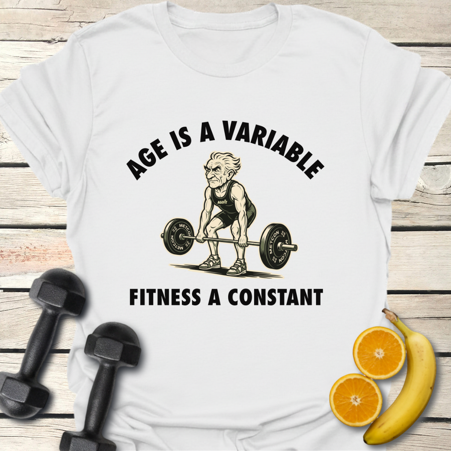 Age Is a Variable Fitness a Constant T-Shirt displayed on a green shirt with weights, fruit, and a motivational design.
