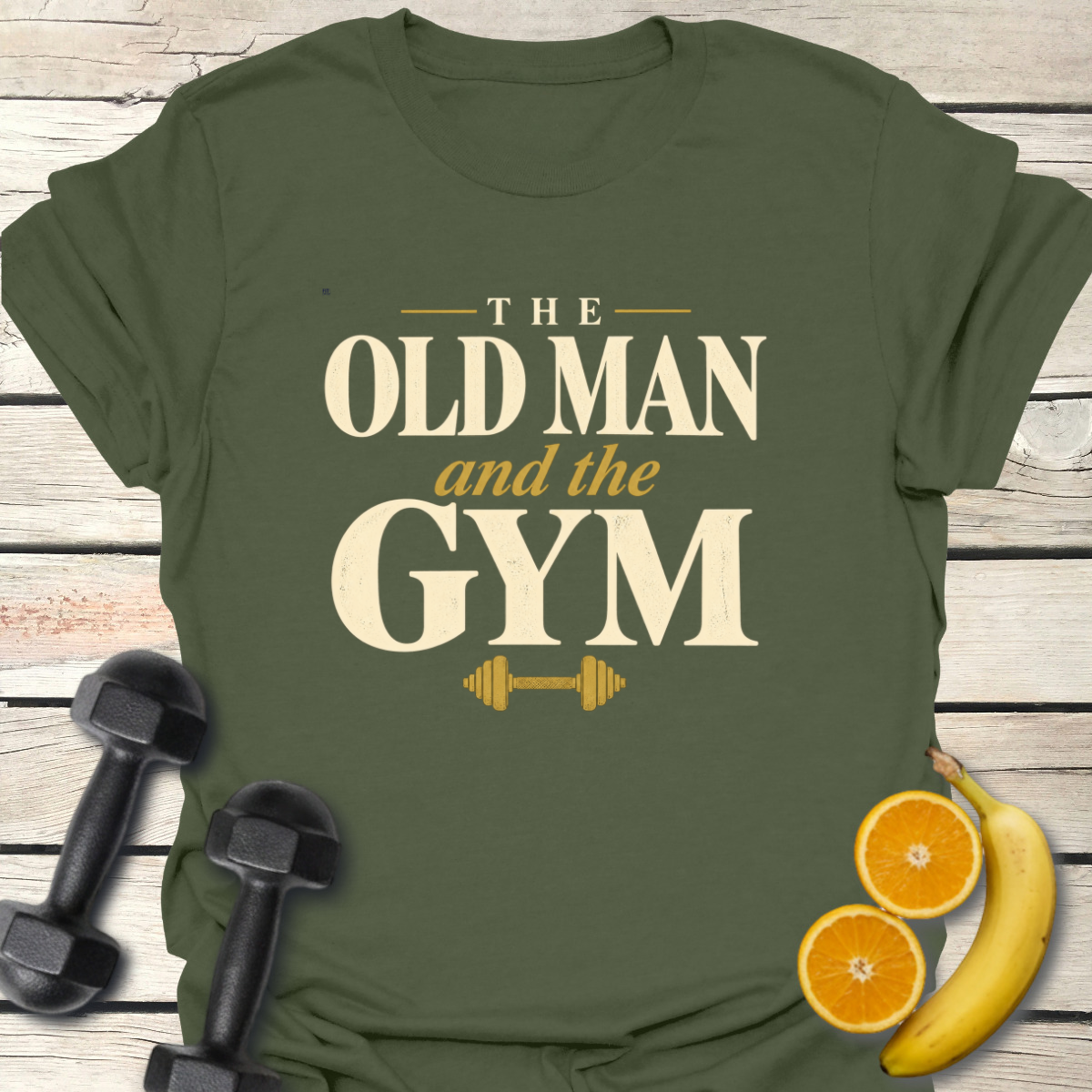 Old Man and the Gym T-Shirt featuring a unique design on a green shirt with gym weights and fruits.